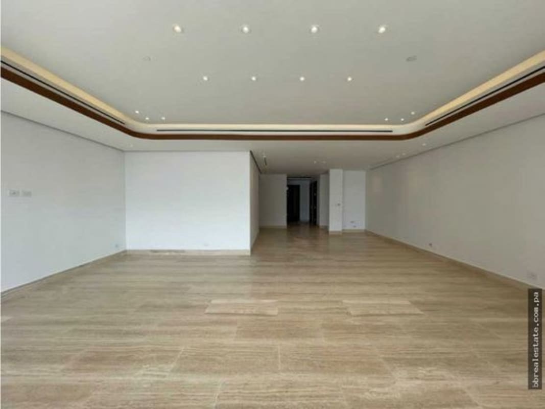 Modern luxury bathroom with marble counters, double sink, and glass-enclosed rain shower at PH The Towers Panama