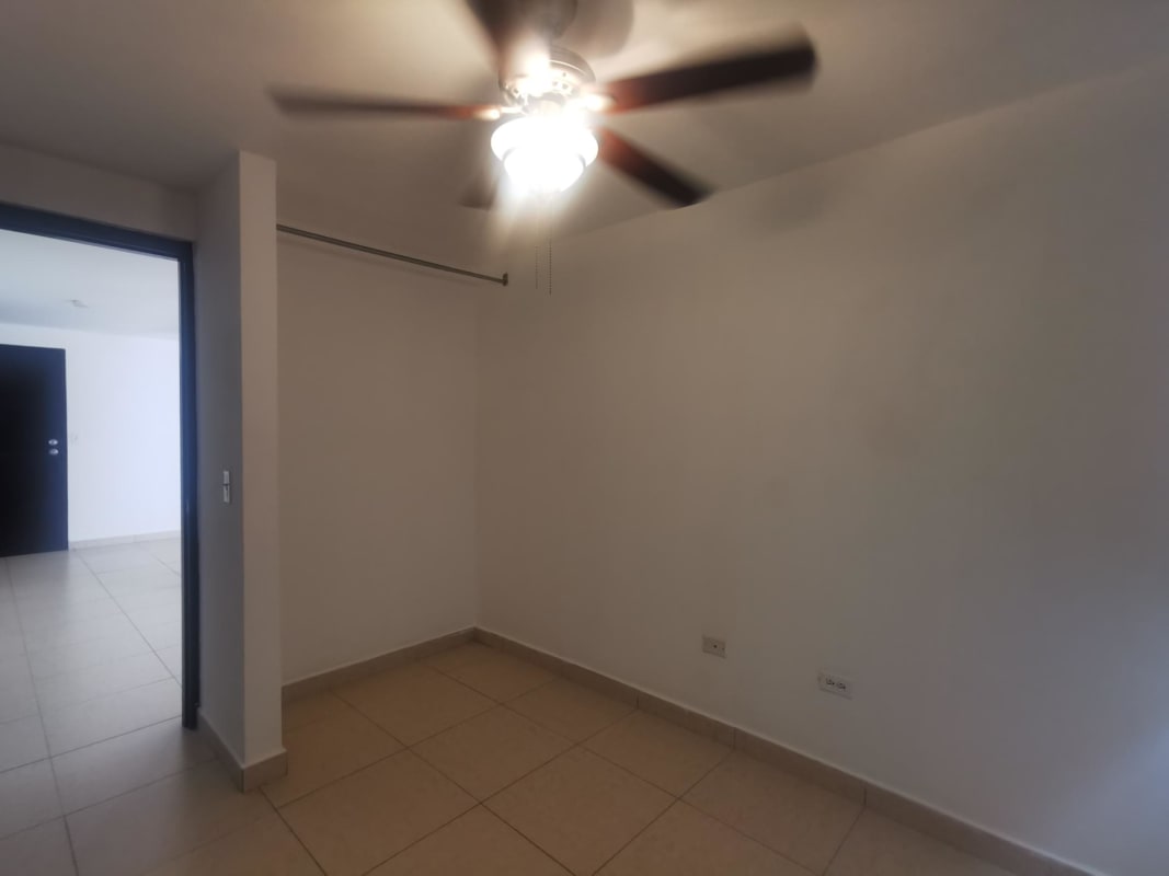 Bedroom with closet open space window and fan HIP Tower Panama City apartment