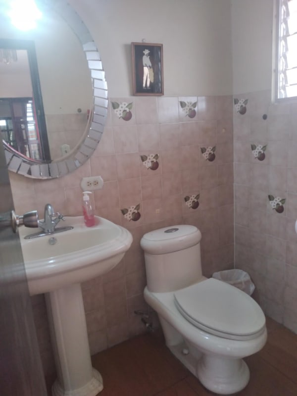 Kitchen with granite counters, modern appliances and breakfast bar in house for sale Altos de Panamá Panama