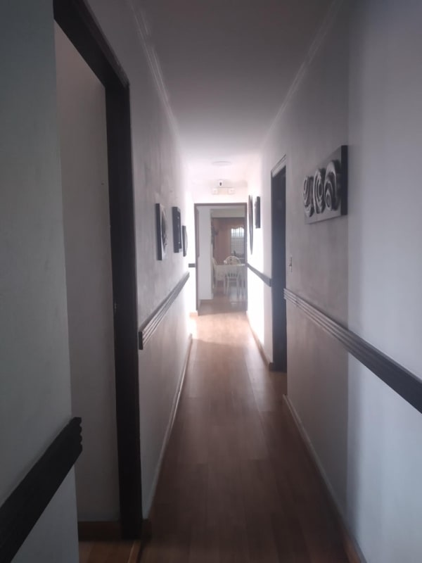 Long hallway with wood floors leading to dining area house for sale Altos de Panamá Panama