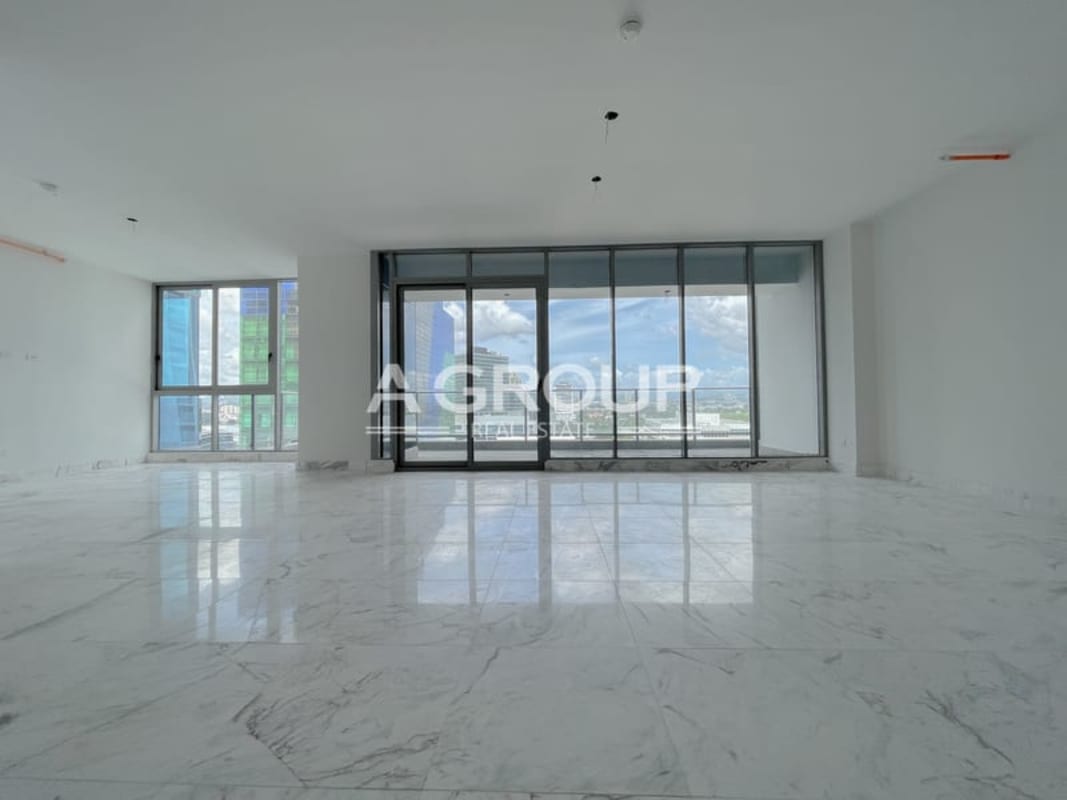 Spacious unfurnished living dining area with marble floor and panoramic windows Costa del Este Panama