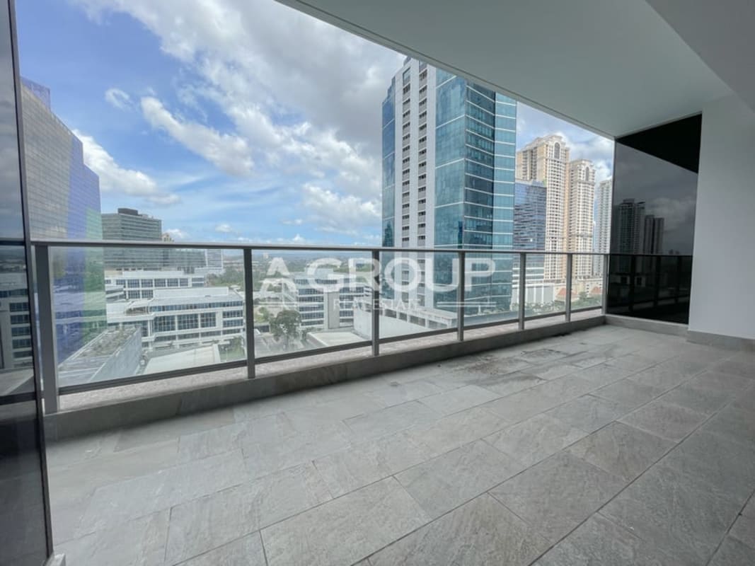 High-rise balcony with glass railing overlooking Pacific Ocean and city skyline in PH Regalia Costa del Este Panama