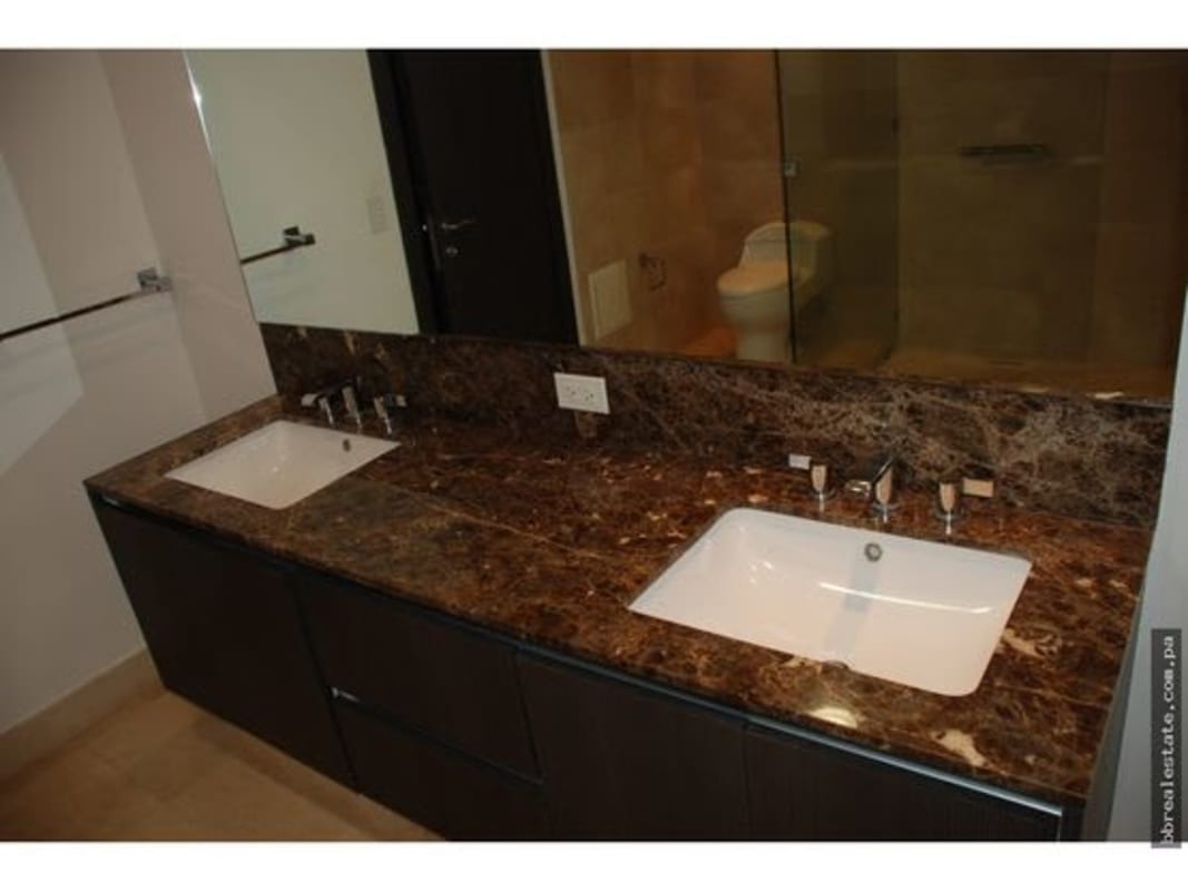 Spacious master bathroom with double sinks, marble counters, glass shower PH TOC Punta Pacifica