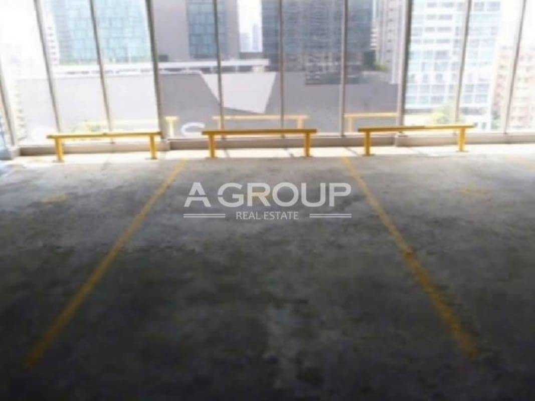 Modern glass high-rise exterior of SFC Tower located in Obarrio Panama's business district