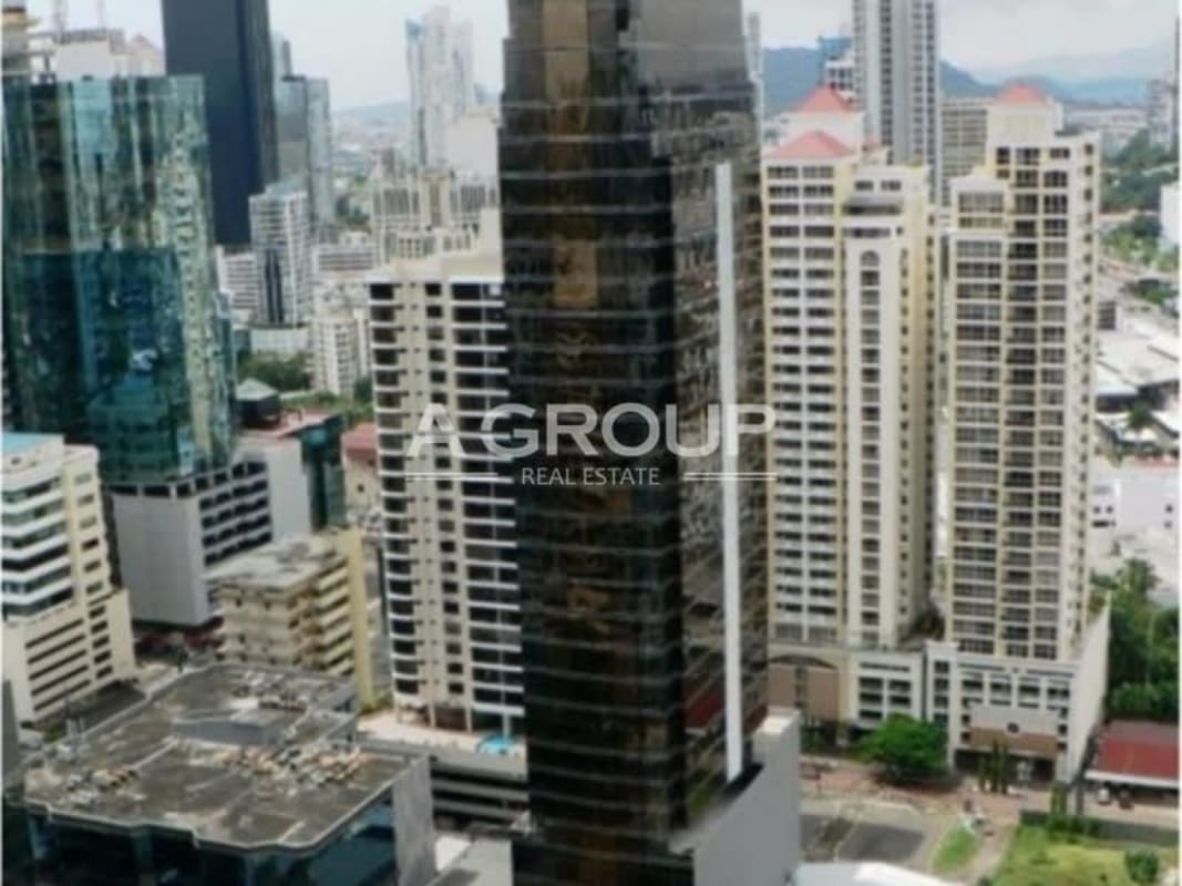 Office interior with floor-to-ceiling windows and Panama City skyline view at SFC Tower