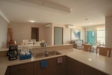 Large balcony with glass railing overlooking ocean and lagoon in Playa Blanca Panama