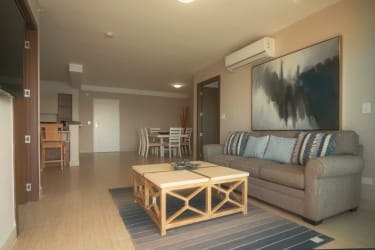 Master bedroom with large window overlooking ocean Laguna in Playa Blanca Panama