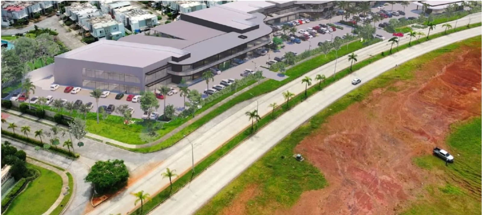 Wide aerial of Plaza Paseo Drive showing parking lots, soccer field, residential area Brisas del Golf Panama