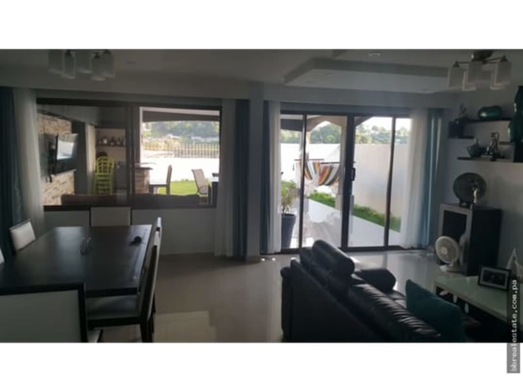 Living and dining area with view to garden patio in Green Villas Las Cumbres Panama City