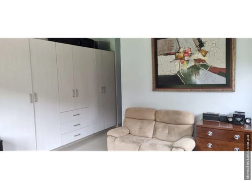 Modern bedroom with wardrobe shelving in Green Villas Las Cumbres Panama