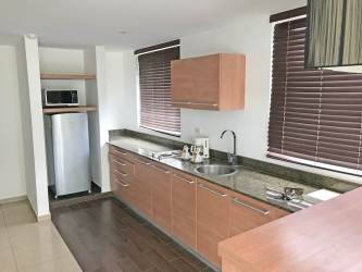 Dining and kitchen open area with natural light in Playa Blanca beachfront condo Rio Hato Panama