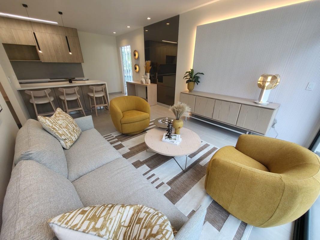 Contemporary American-style kitchen with breakfast bar in PH Midtown Costa del Este condo