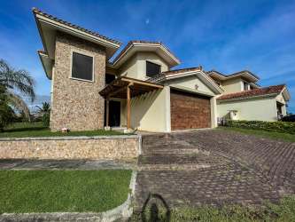 Mediterranean-style luxury beach villa with stone accents, tiled roof at Vista Mar in San Carlos Panama