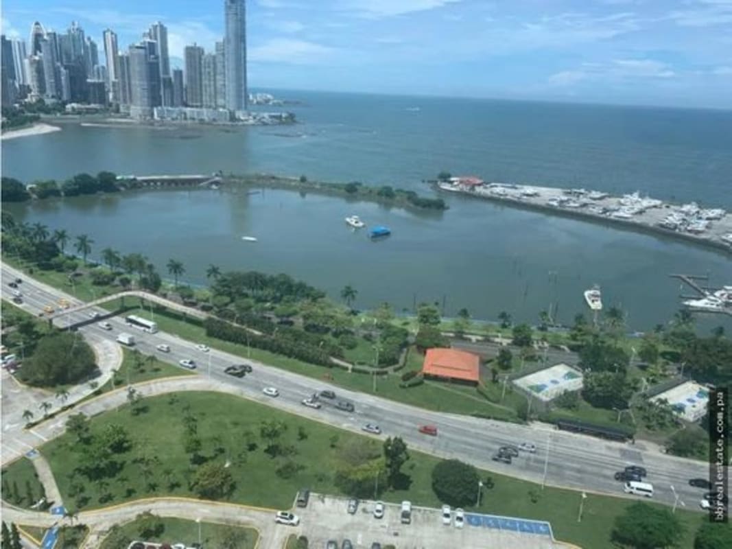 Aerial of PH White Tower with Marina Cinta Costera and waterfront park Avenida Balboa Panama City
