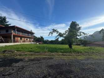 Rural paved road with greenery, homes, and panoramic mountain views at Altos del María Panama