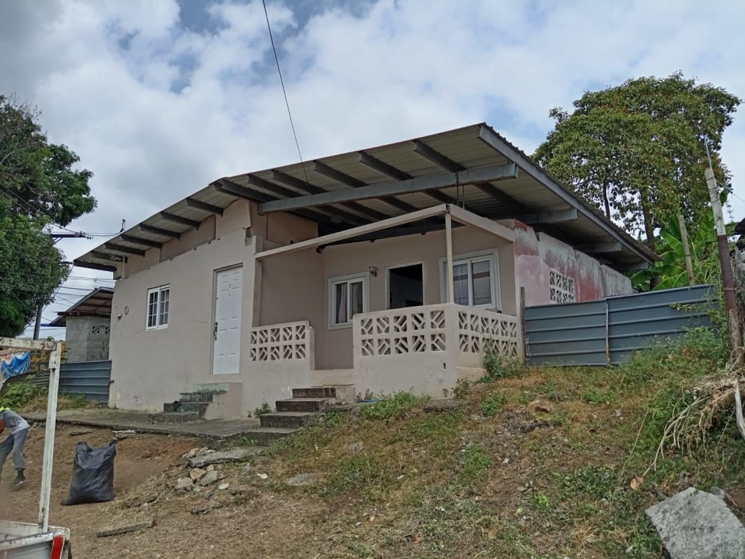 Porch and metal roof of modest affordable home Rio Abajo Panama City panoramic view