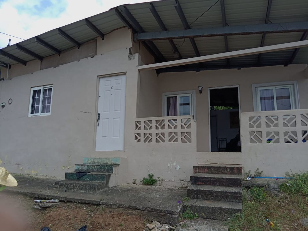 Exterior with front porch and concrete railing affordable house in Rio Abajo Panama