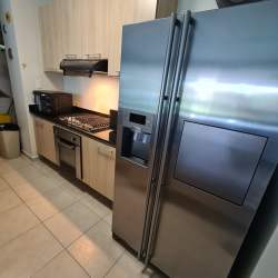 Furnished covered terrace on ground floor unit at Bijao resort with fans garden view