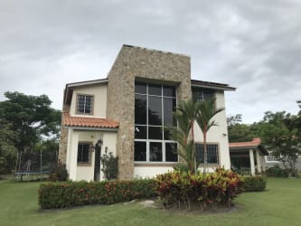Modern Mediterranean country house with tile roof and porch Quebradas de Cabuya Panama