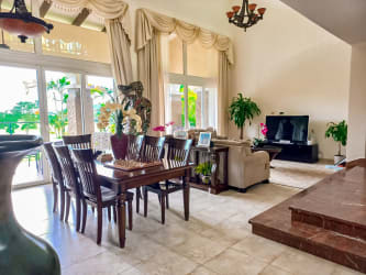 Elegant dining and living room space with natural light in luxury villa Tucan Country Club Panama