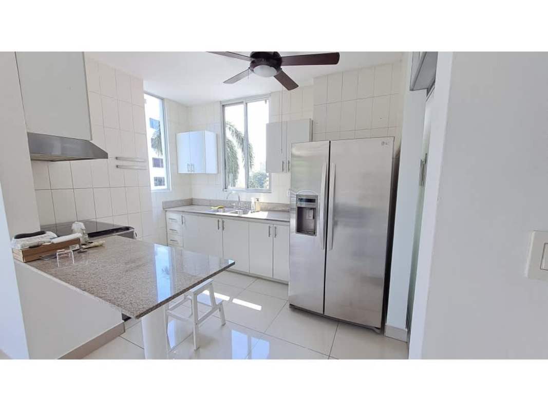 Contemporary kitchen with granite counters, stainless appliances, and city views in PH Vita Bella