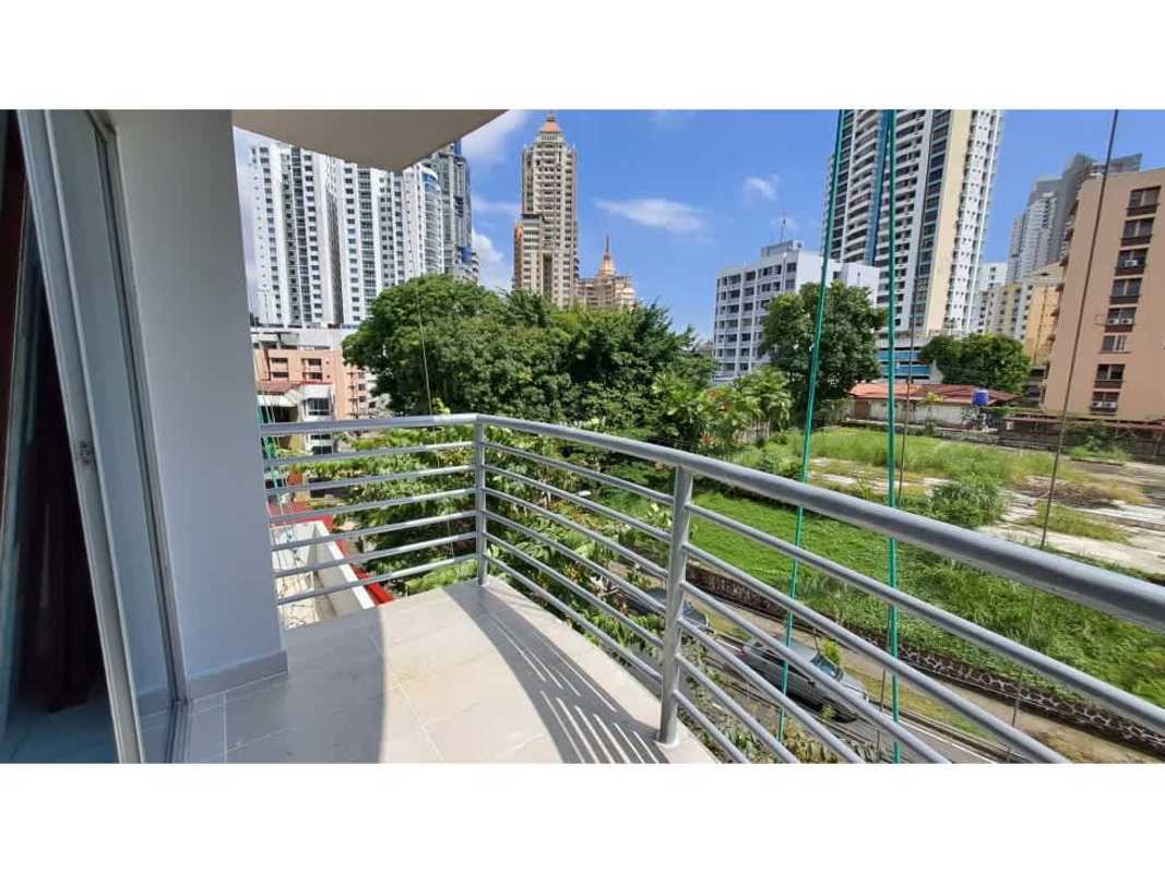 Large bedroom with tile floors, built-in closet, and city view window in PH Vita Bella El Cangrejo Panama City