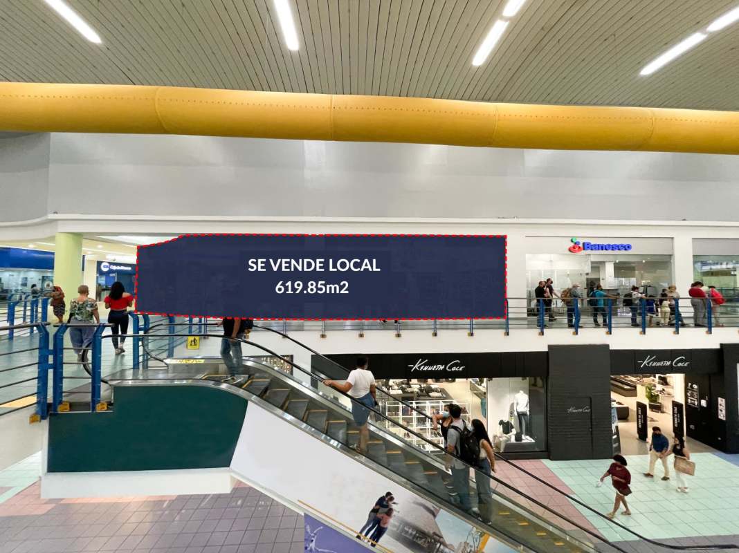 Mall corridor with multiple retail units, colorful design, and open kiosk areas inside Albrook Mall