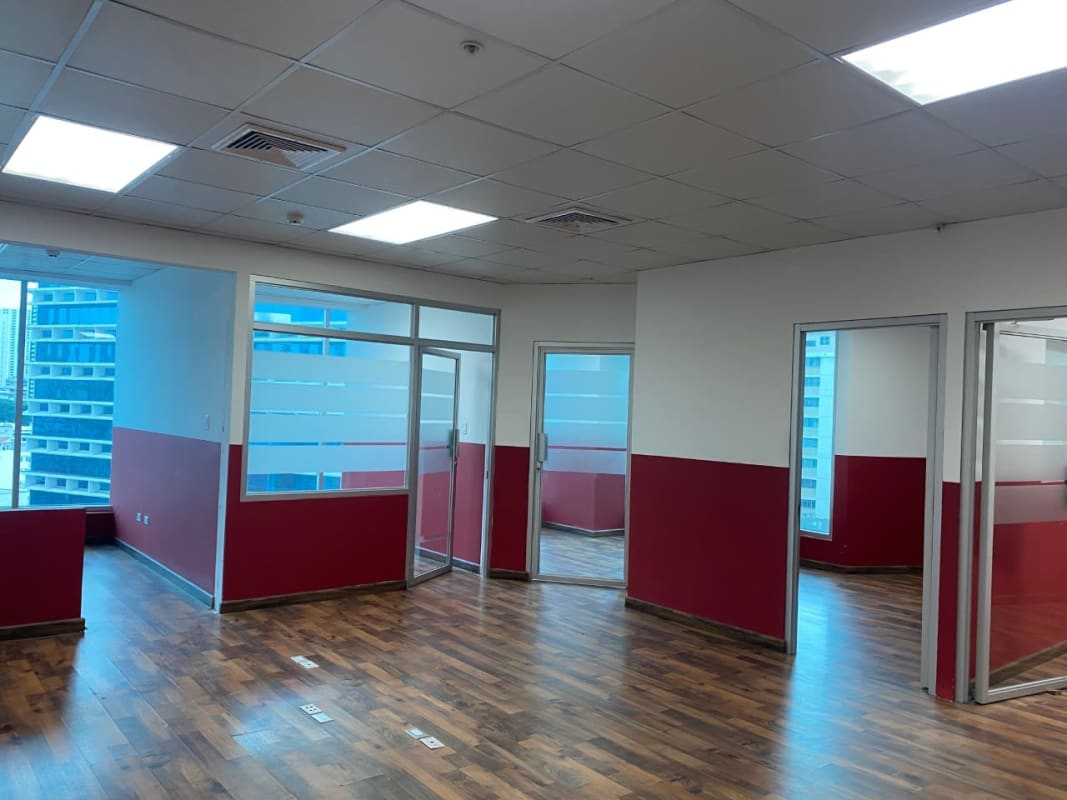 Glass divided office spaces with wood-look flooring in PH Marble Tower Marbella