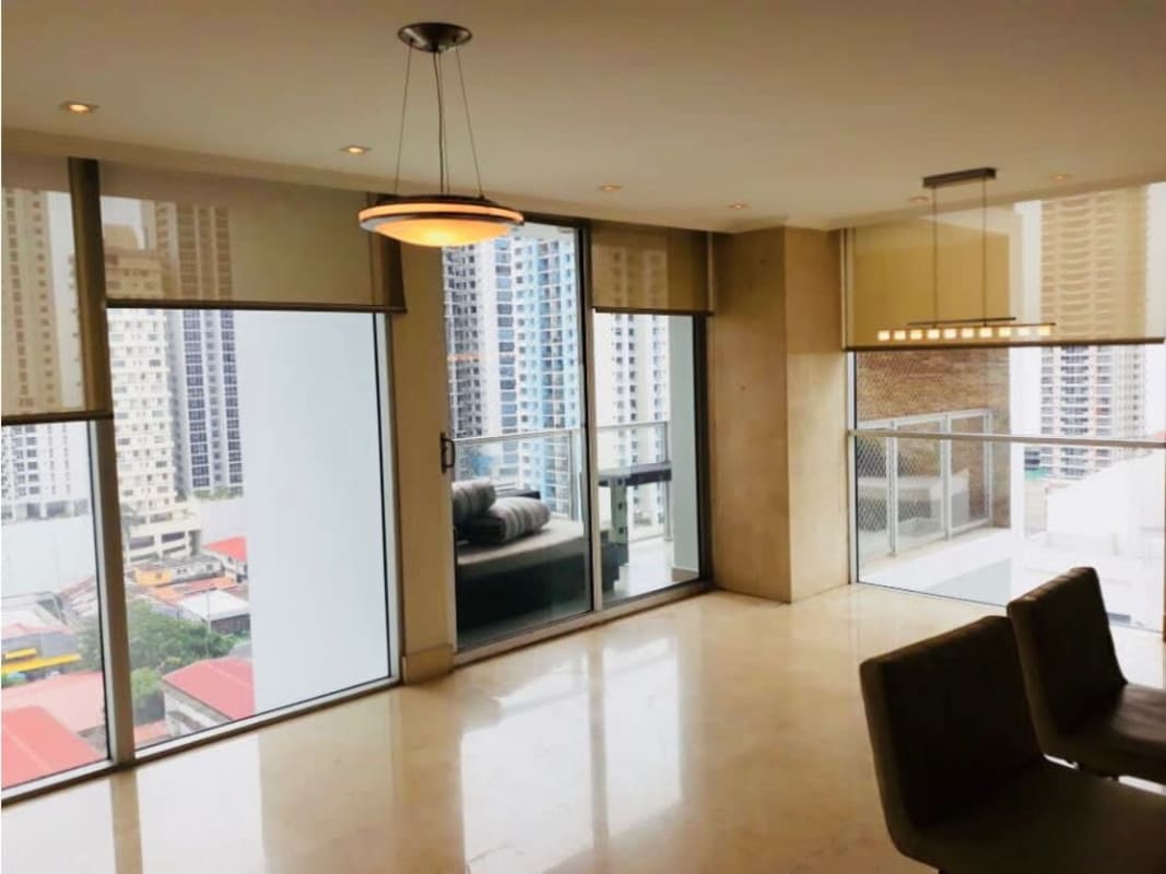 Open plan living dining area with marble floors and balcony access luxury apartment San Francisco Panama