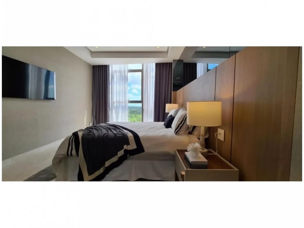 Contemporary dining room with panoramic windows, city and golf views at La Maison by Fendi Panama