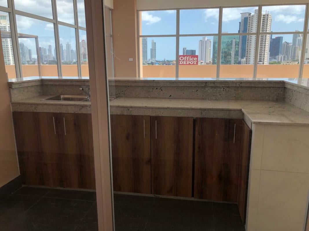 Swimming pool with lounge chairs and skyline views PH Vicky Village Panama