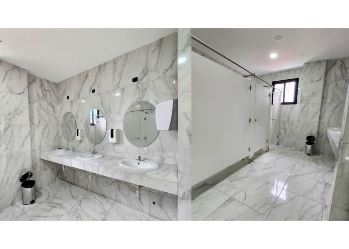 Marble finish restrooms with modern fixtures in The Gray mixed use tower Panama