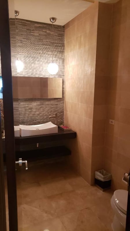 Open plan living and dining with large windows, contemporary decor at PH Acqua II Costa del Este