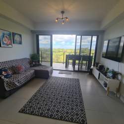 Bright second bedroom with window garden view at Punta Caelo resort apartment San Carlos