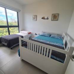 Master bedroom with sliding glass doors to oceanview terrace at Punta Caelo San Carlos rental