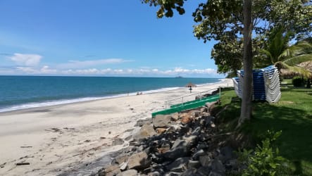 Bright living and dining with coastal decor ceiling fans TV at Gatun Bijao Santa Clara