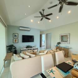 Spacious covered terrace with seating and BBQ overlooking Bijao golf course in Santa Clara Panama