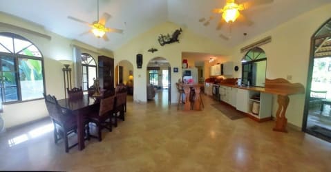 Elegant two-story villa balcony and lush landscaping Altos del Maria Panama