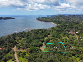 Aerial photo of green tropical plot outlined near dirt access road close to Playa Santa Catalina Panama's famous surf beach
