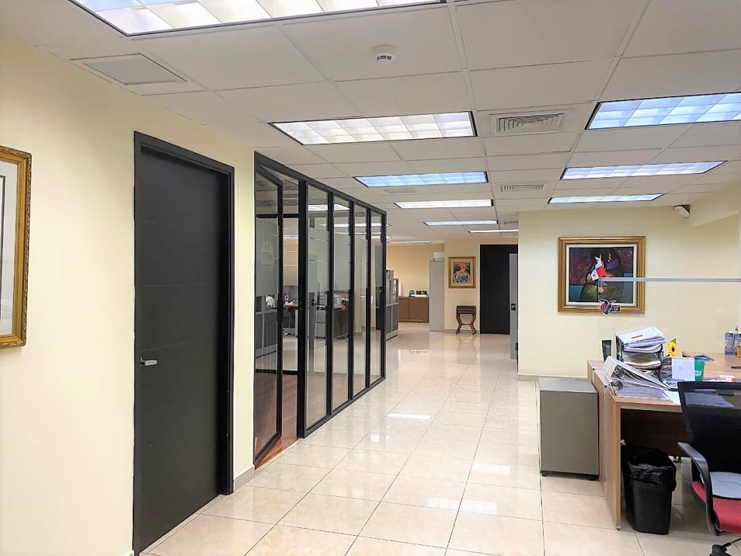 Curved reception desk with glass divider in commercial property lobby Panama City