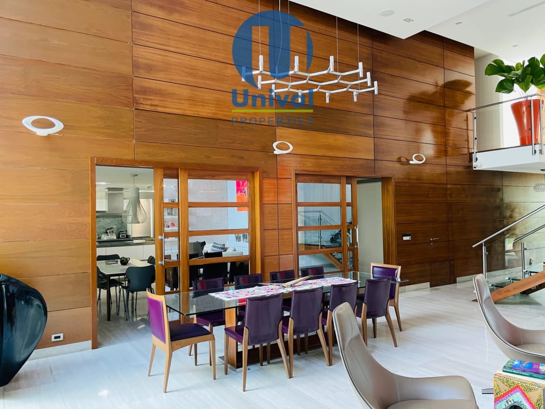 Modern kitchen with marble island, stainless appliances and wine fridge in PH Costa Esmeralda Costa Sur Panama