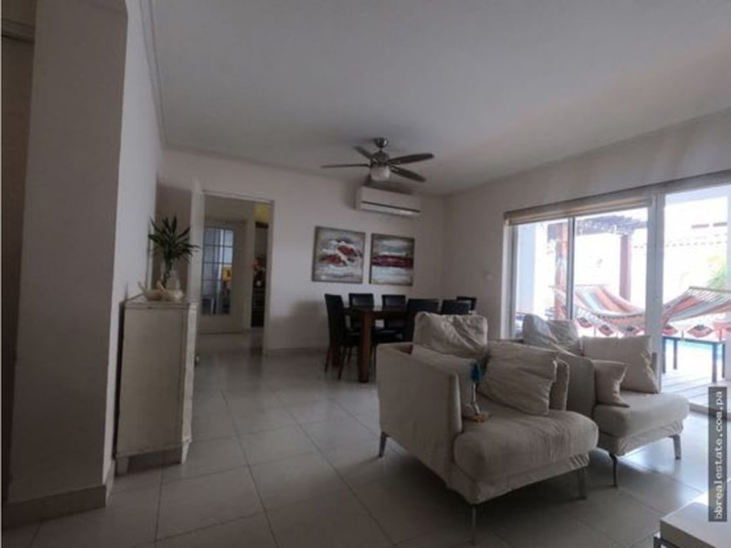 Bright living and dining area with large sliding doors opening to terrace in Quintas de Versalles Costa Sur