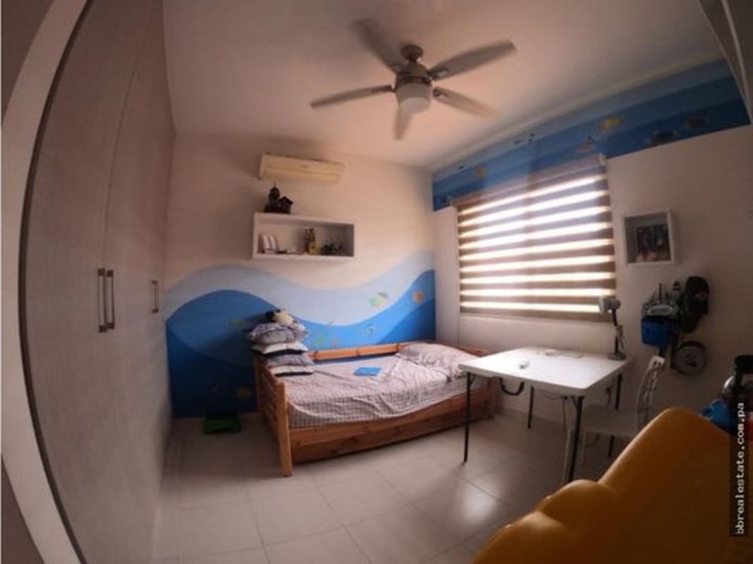 Kids bedroom with ocean-theme mural, ample closet in Quintas de Versalles Costa Sur Panama
