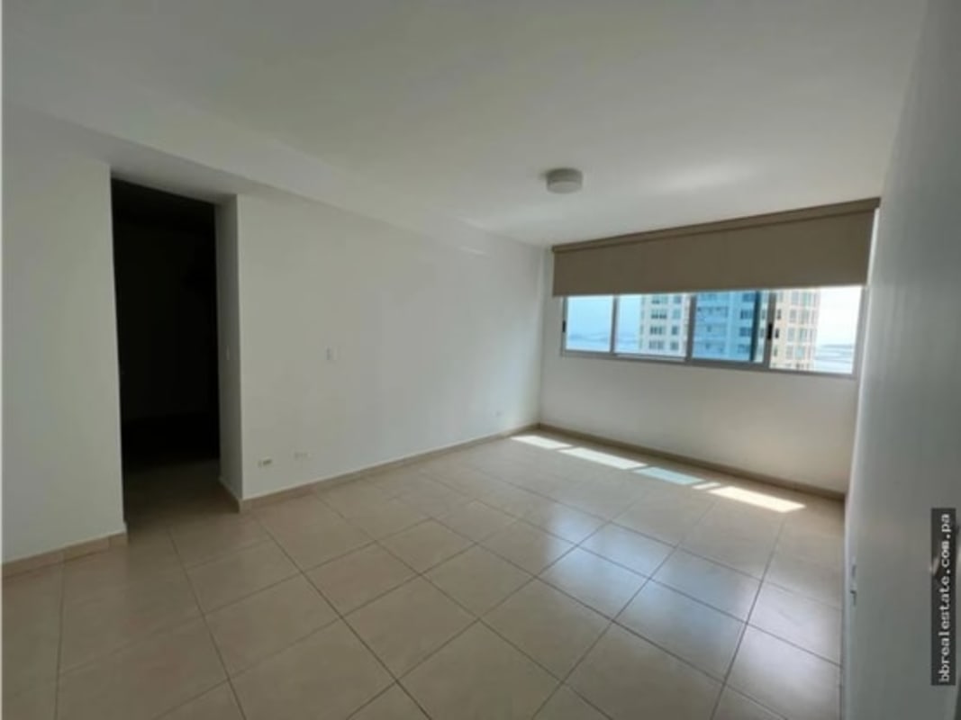 Spacious living room with floor-to-ceiling windows and ocean views PH Oasis on the Bay Panama