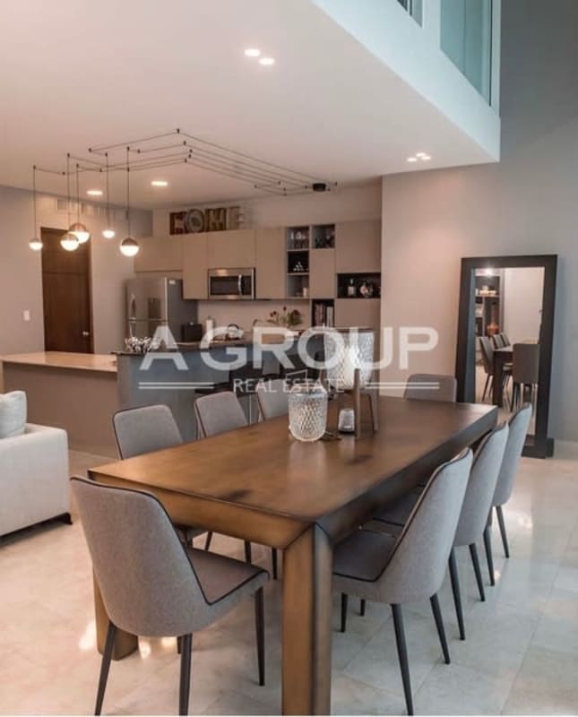 Dining area with pendant lighting open concept loft PH Pacific Village Punta Pacifica Panama