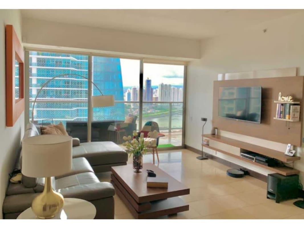 High-rise luxury Panama apartment living room with balcony and ocean view in The Ocean Club JW Marriott