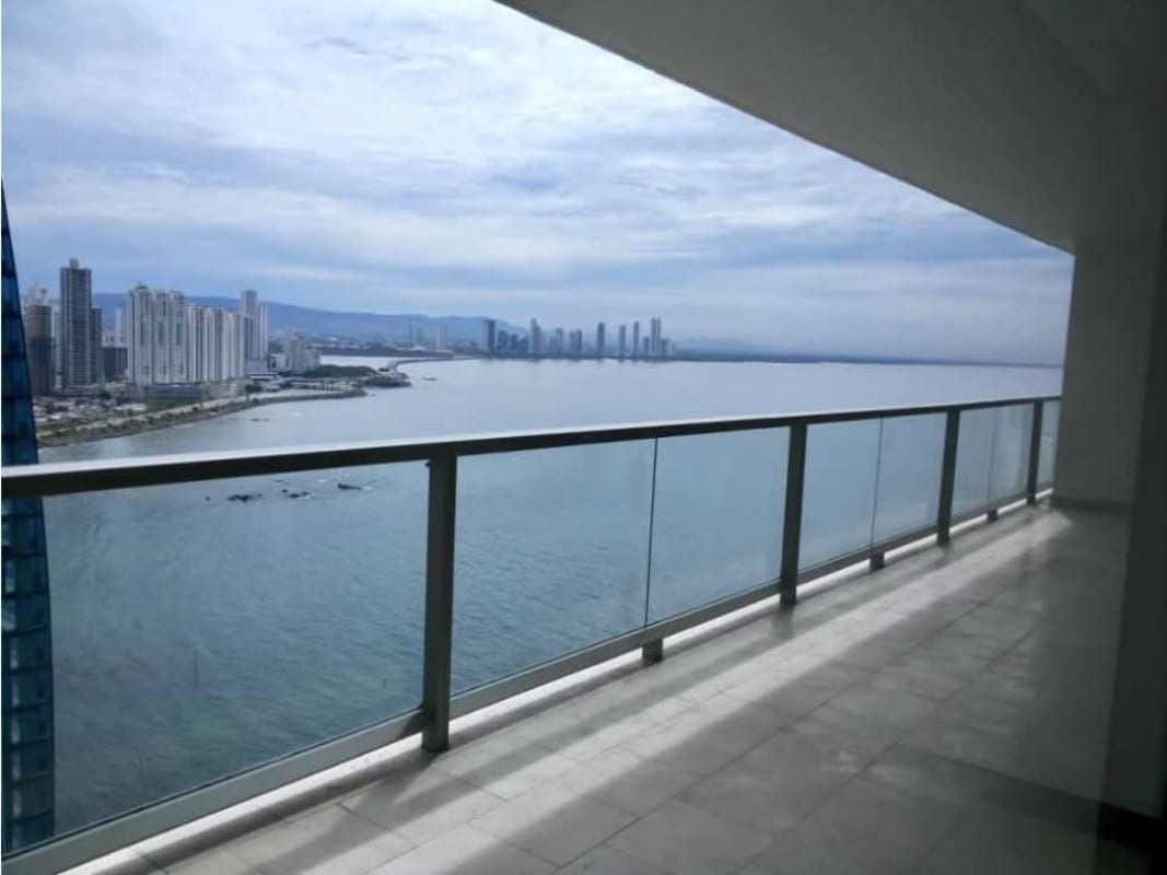Spacious modern balcony with glass railing and panoramic ocean views at The Ocean Club JW Marriott Panama