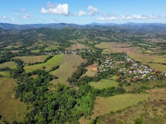 Large land acreage with rolling hills, scattered trees, mountain views near Soná Veraguas