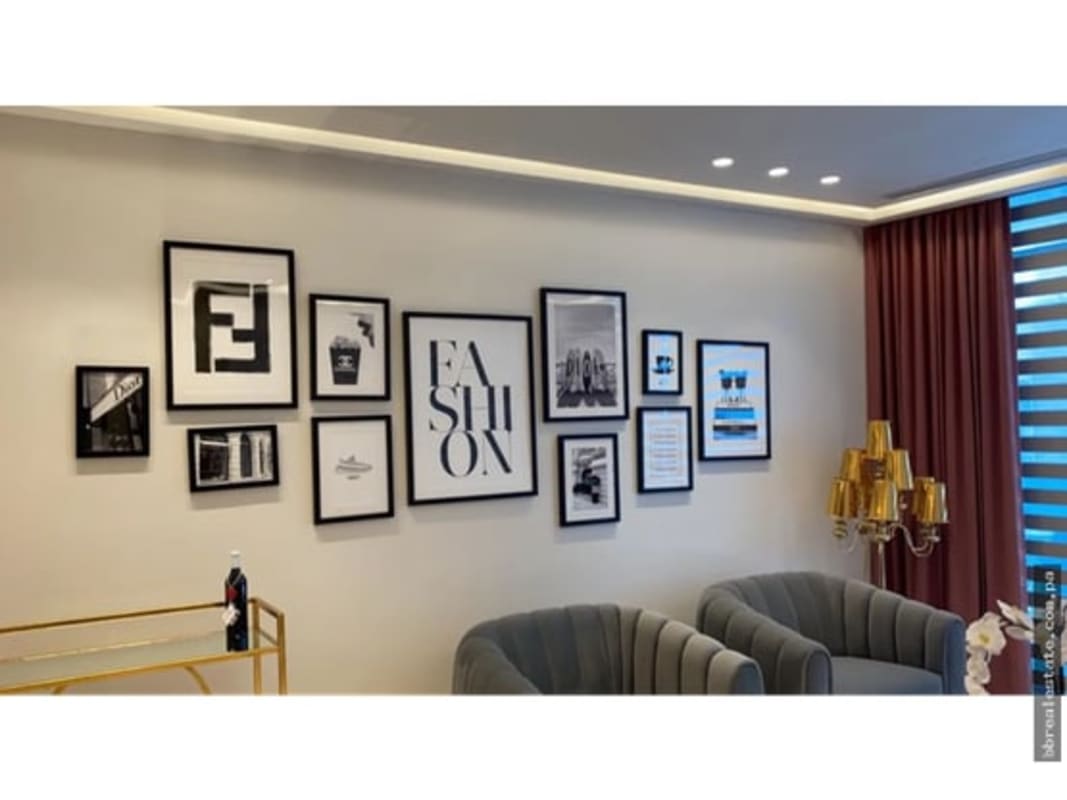 Master bedroom with large windows and panoramic ocean view in PH Grand Tower Punta Pacifica