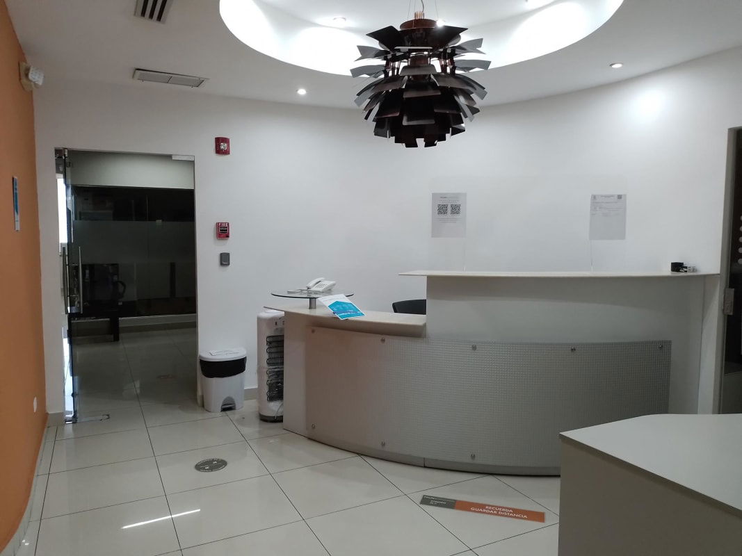 Modern reception area with curved counter Pacific Point Punta Pacifica commercial office